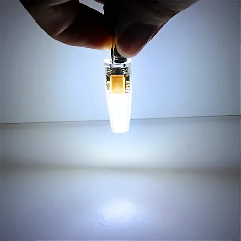A sleek transparent led bulb clip with metallic base and orange internal component for decorbites g4 led 220v cob pack