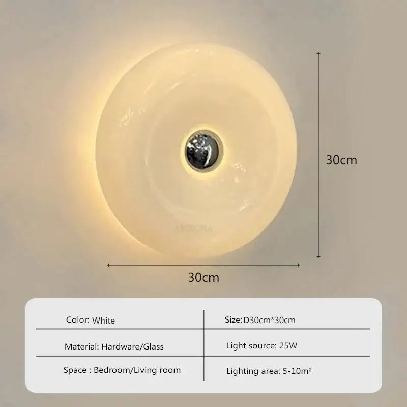 White circular wall sconce with glossy glass donut led shade and metallic center for bedroom decorbites lighting