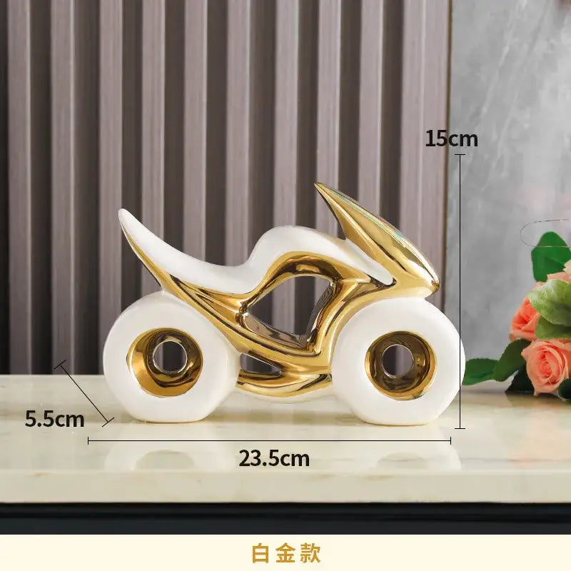 A sleek modern ceramic motorcycle light decoration with a glossy white body and gold accents for living room use