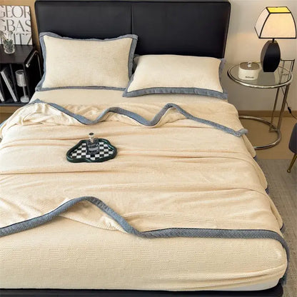 Cream-colored carved velvet blanket with textured knit and soft gray border from decorbites carved velvet collection