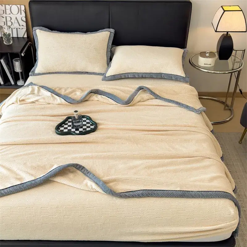 Cream-colored carved velvet blanket with textured knit and soft gray border from decorbites carved velvet collection