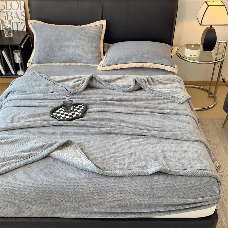 Light blue textured velvet blanket with subtle ribbed pattern from DecorBites carved velvet fleece throw collection