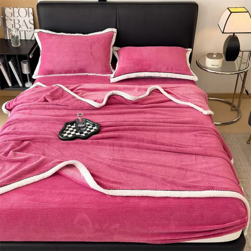 Pink plush blanket with white fleece trim as part of decorbites carved velvet blanket living room fleece throw collection