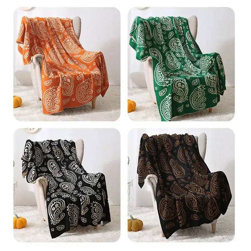 Orange green black and brown paisley-patterned decorbites cashew pattern fleece blankets draped on white armchairs