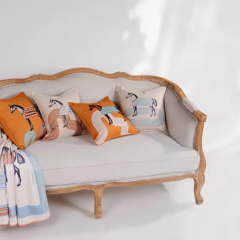 Beige upholstered sofa with ornate light wood frame and decorbites 45x45 square orange horse 45x45 square throw pillowcase living room decor