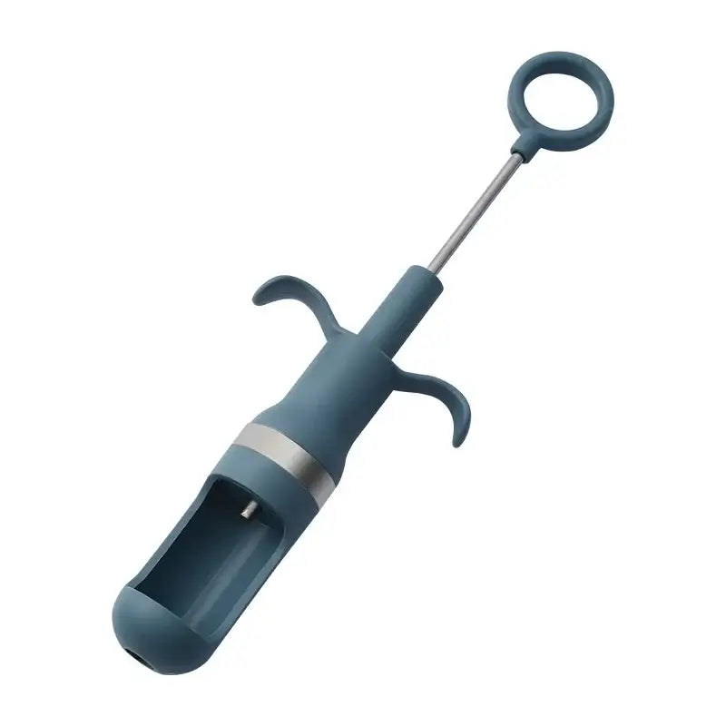 Teal plastic and stainless steel ice cream scoop with looped handle shown alongside orange metal cherry pitter fruit core remover tool