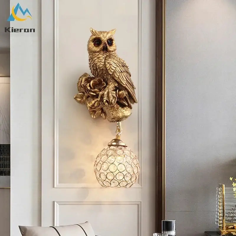 Golden owl-shaped wall lamp with intricate feather detailing and crystal globe lampshade for decorbites crystal led wall use