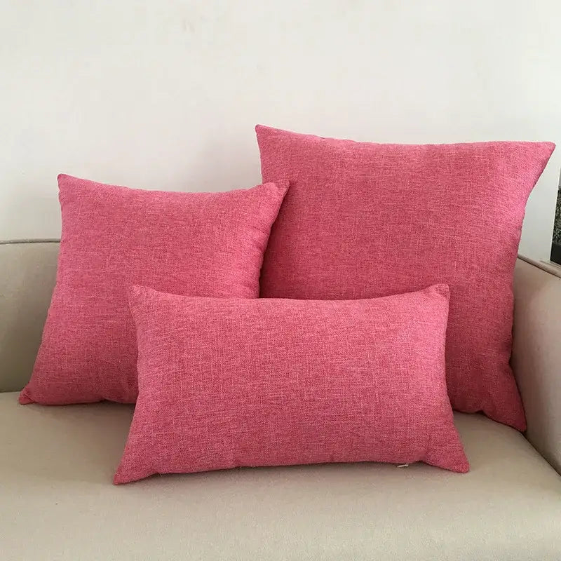 Three pink textured throw pillows on a beige couch featuring decorbites ivory sofa cushion cover set for living room decor