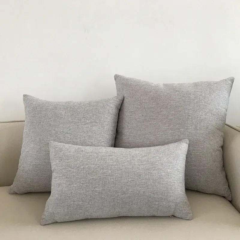 Set of three gray textured linen cushion covers in varying sizes for decorbites ivory sofa cushion and living room decor