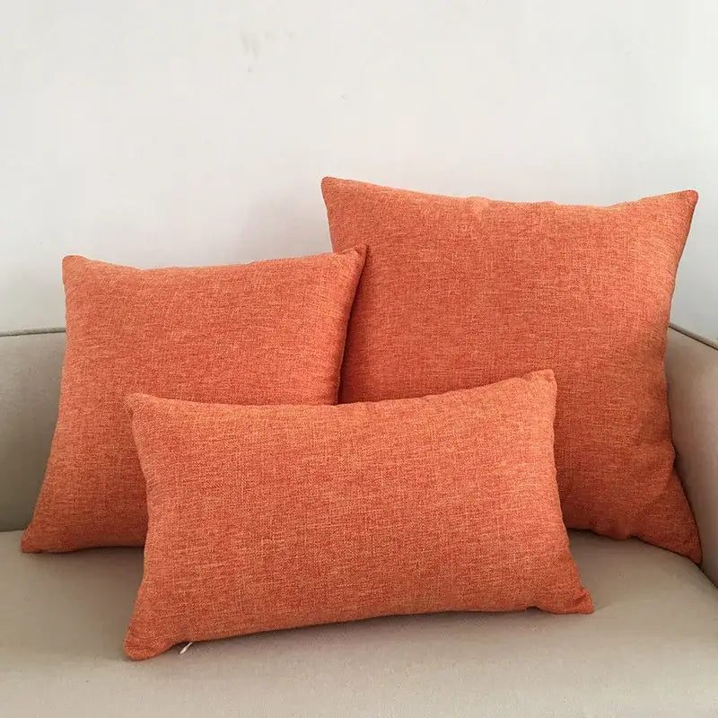 Set of three orange textured linen cushion covers for decorbites ivory sofa cushion living room use