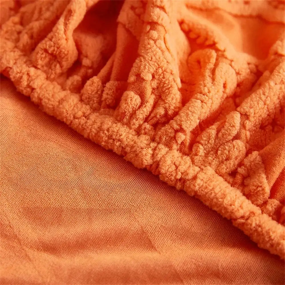 Orange and white jacquard velvet sofa seat cover with plush textured fabric and raised edge pattern for living room protector