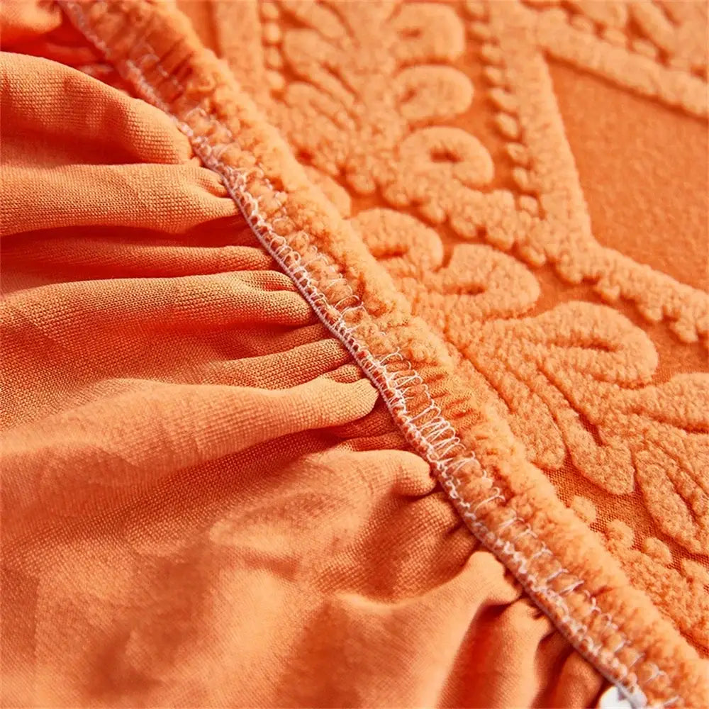 Orange and white jacquard velvet sofa seat covers with orangish-orange textured fabric and raised floral embroidery