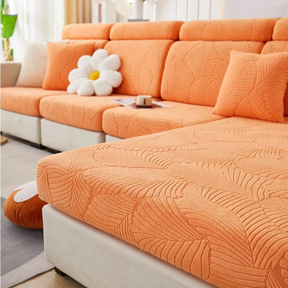 Orange and white leaf jacquard stretch sofa cover featuring a protective leaf pattern for living room sofas