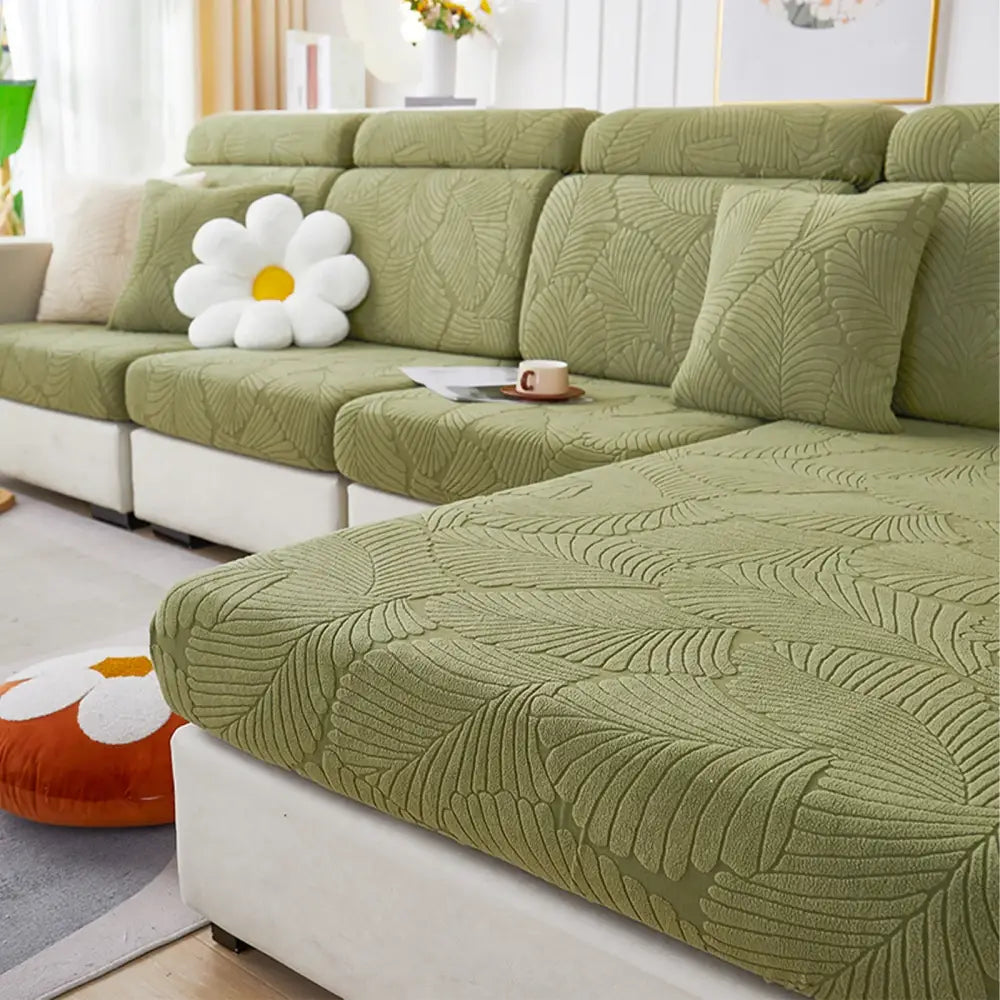 Olive green leaf-patterned textured fabric sofa cover with matching cushions for orange and white jacquard stretch living room protector