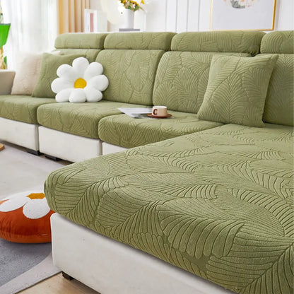 Olive green leaf-patterned textured fabric sofa cover with matching cushions for orange and white jacquard stretch living room protector