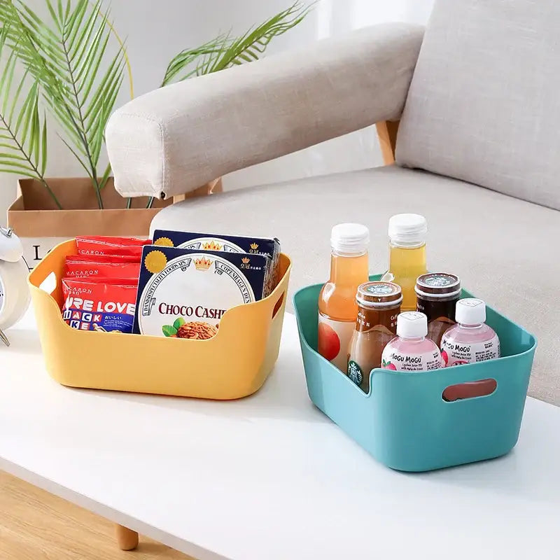 Two colorful plastic storage boxes in yellow and teal with side handles for decorbites desktop storage basket organizer