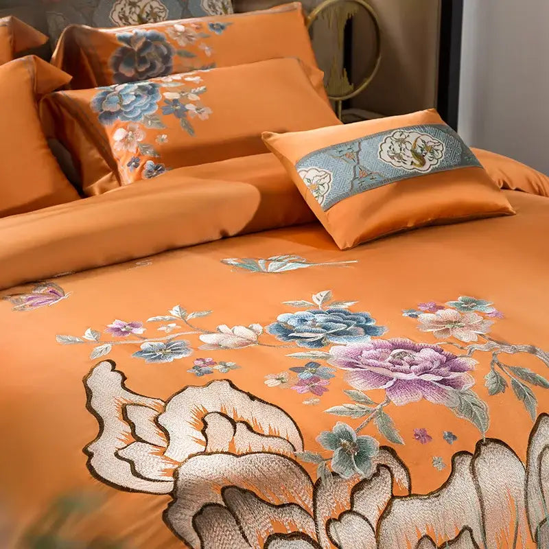 Orange satin bedding set with intricate blue purple white floral 200s embroidery egyptian cotton and teal pillow band