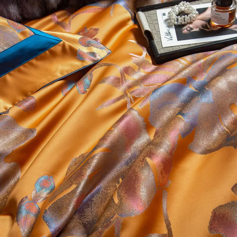 Golden satin bedspread with intricate floral patterns in metallic blue pink and bronze in egyptian cotton silk jacquard bedding set