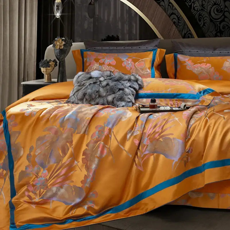 Lush orange satin bedding set with floral patterns and blue trim in orchid golden orange teal egyptian cotton silk jacquard