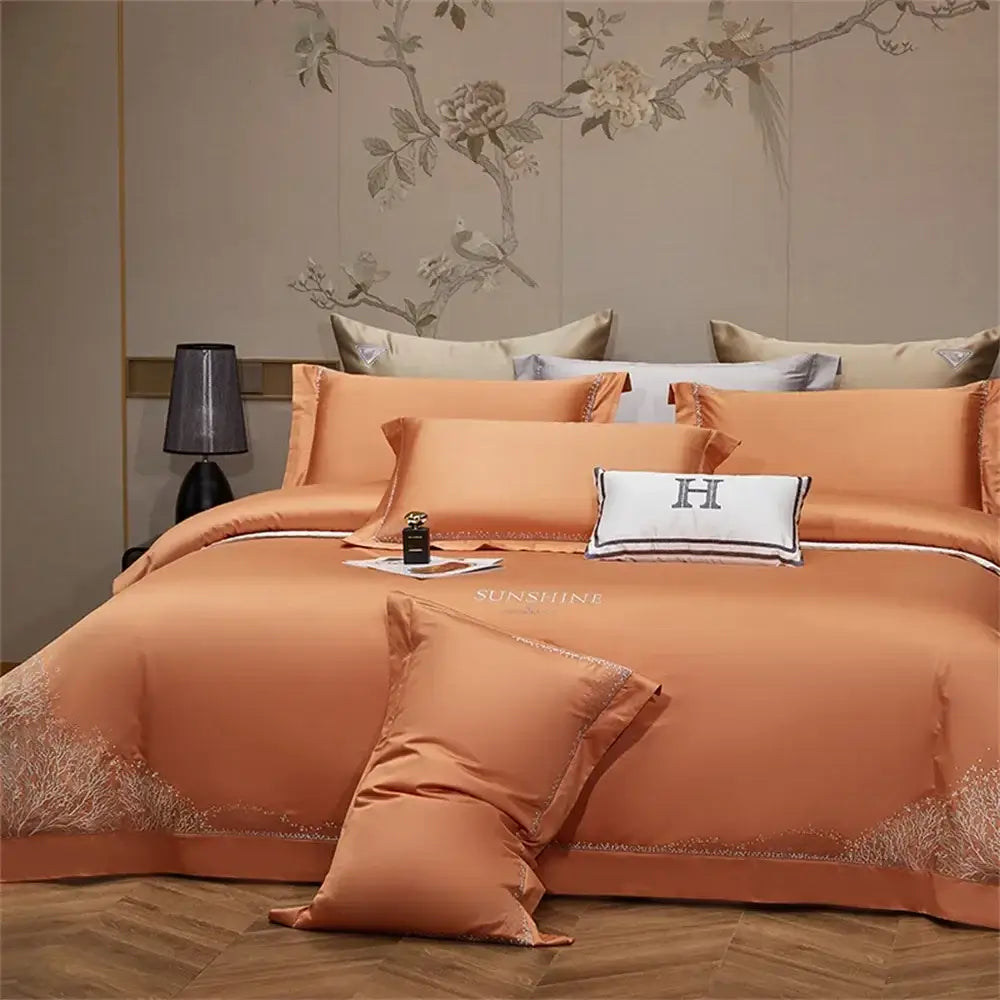 Orchid jacquard embroidery egyptian cotton bedding set with gold embroidery and white accent pillow featuring embroidered h