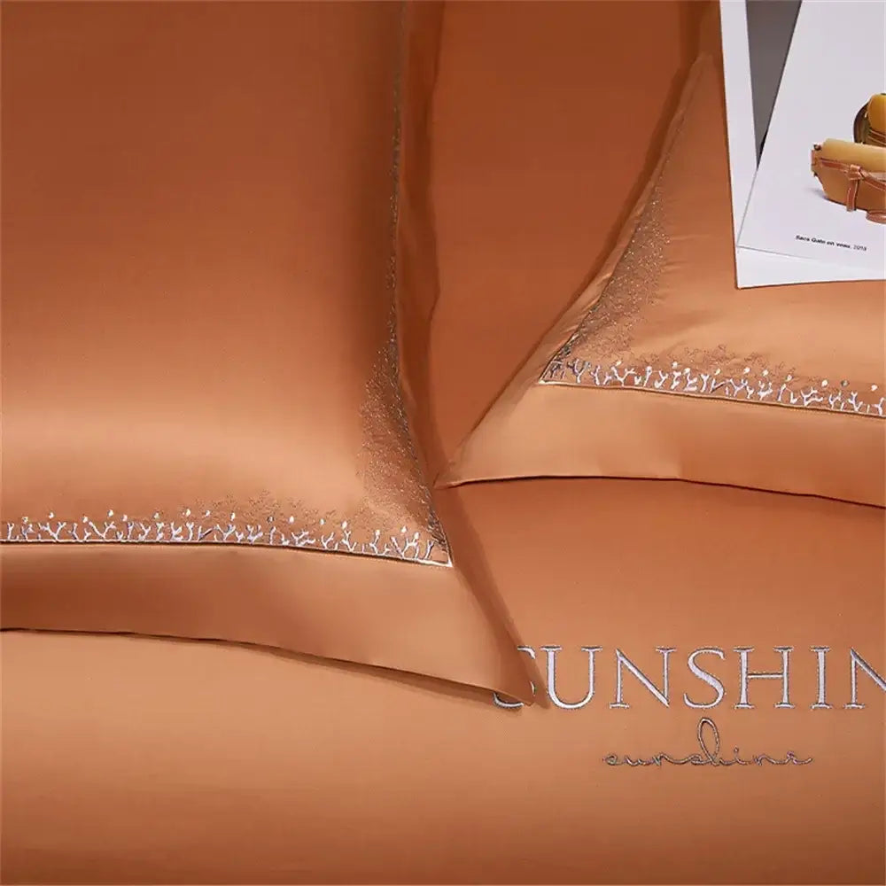 Copper-colored satin pillowcases with delicate silver thread decorbites jacquard embroidery in egyptian cotton bedding set