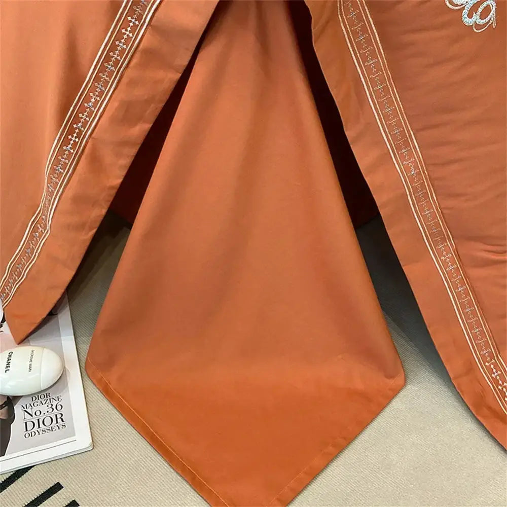 Luxurious rust-colored satin pillowcase with gold-threaded embroidery from decorbites 1200tc egyptian cotton bedding set