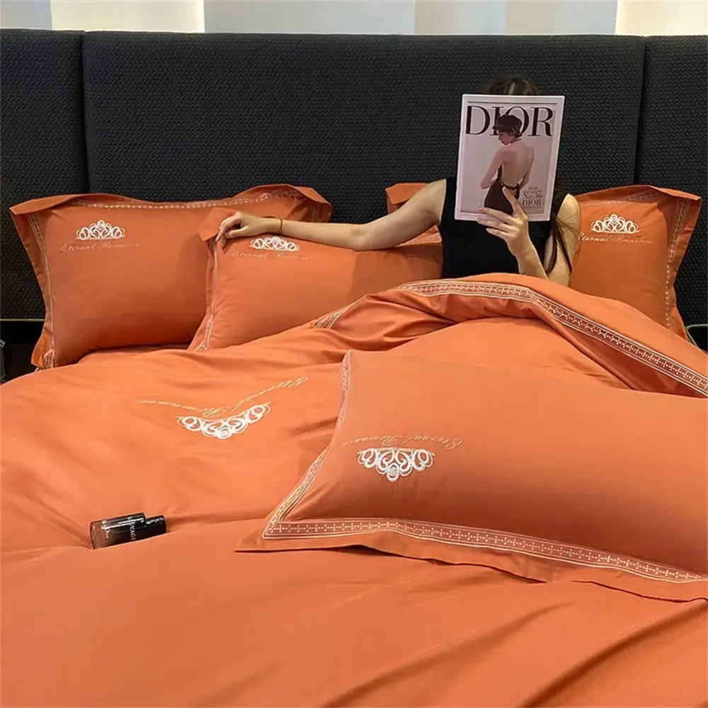Orange satin bedding set with white embroidered floral patterns and gold trim decorbites 1200tc egyptian cotton