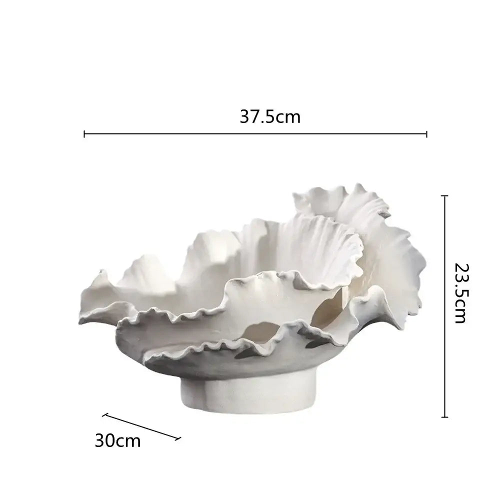 White ceramic coral sculpture with ruffled edges and smooth pedestal base for decorbites ceramic wavy flower vase decor