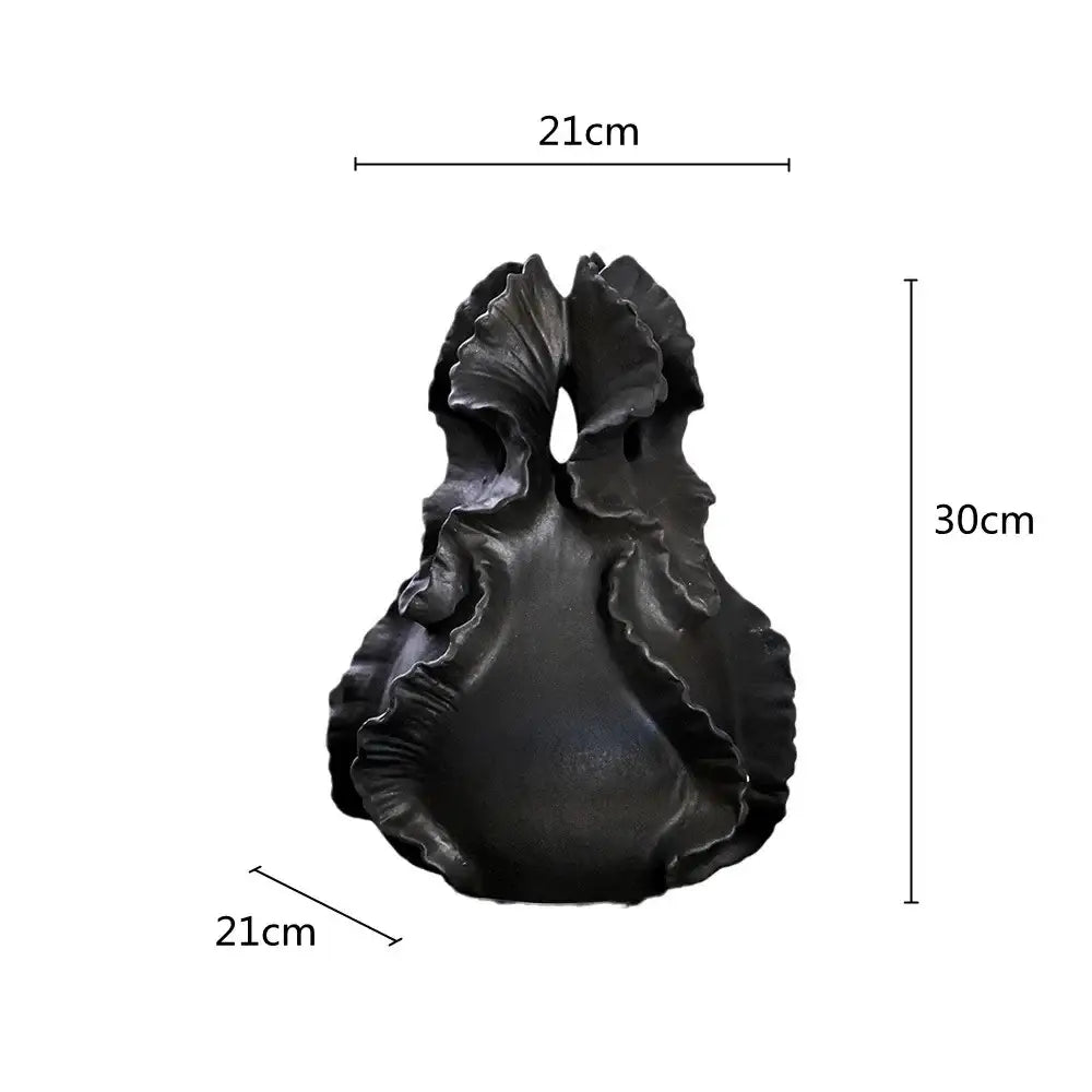 A sleek matte black ceramic wavy flower vase with organic ridges for living room decorbites ceramic wavy storage