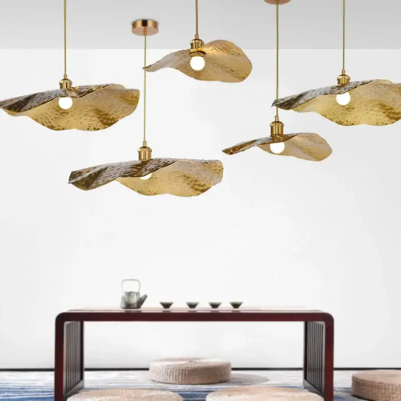 Organic golden iron lotus leaf pendant light with hammered gold-toned iron lotus leaf decorbites design for dining room