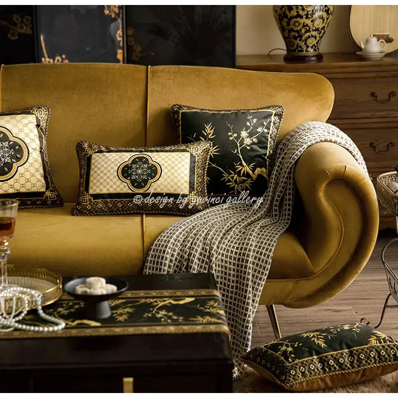 Golden velvet sofa with ornate black and gold embroidered pillow covers decorbites bamboo black gold living room decor