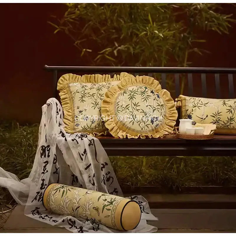 Set of three cream-colored pillow covers with embroidered bamboo and calligraphy on autum orchid velvet lumbar design