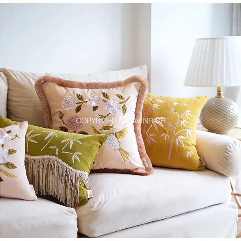 Beige pillow cover with decorbites bamboo embroidered floral and bird design and peach fringed border for bedroom decor