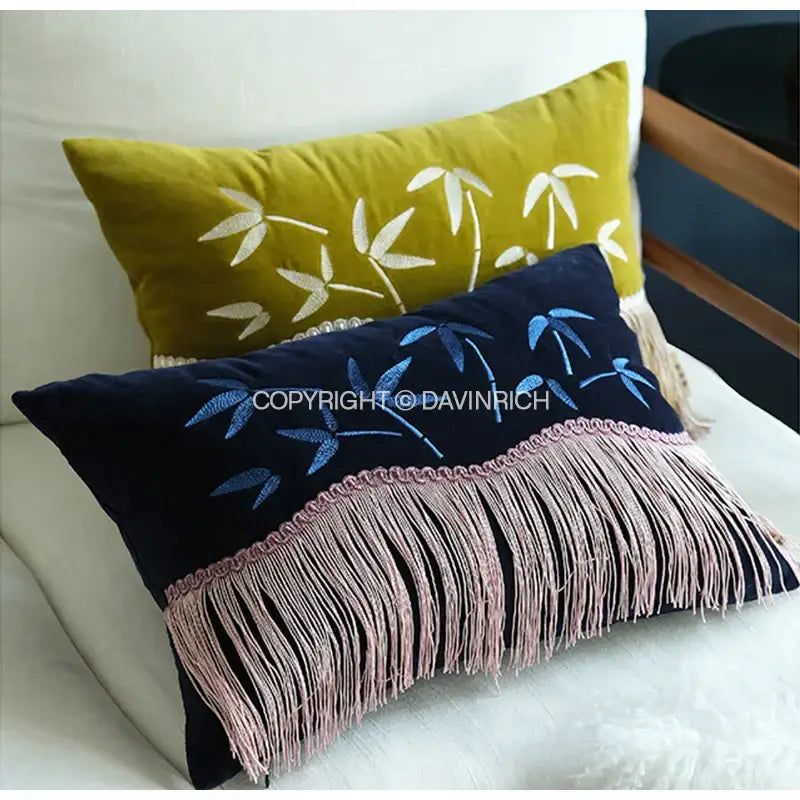 Navy blue velvet pillow cover featuring decorbites bamboo embroidered design with pink fringed edge for bedroom decor