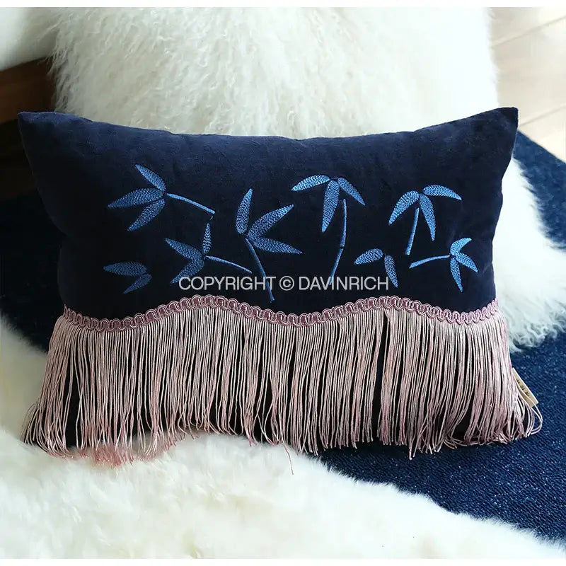 Dark blue velvet pillow cover with light blue decorbites bamboo embroidered leaves and dusty rose fringed tassels