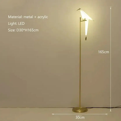 A modern gold-toned origami bird led floor lamp with a sleek metal stand for living room decorbites bird led lighting