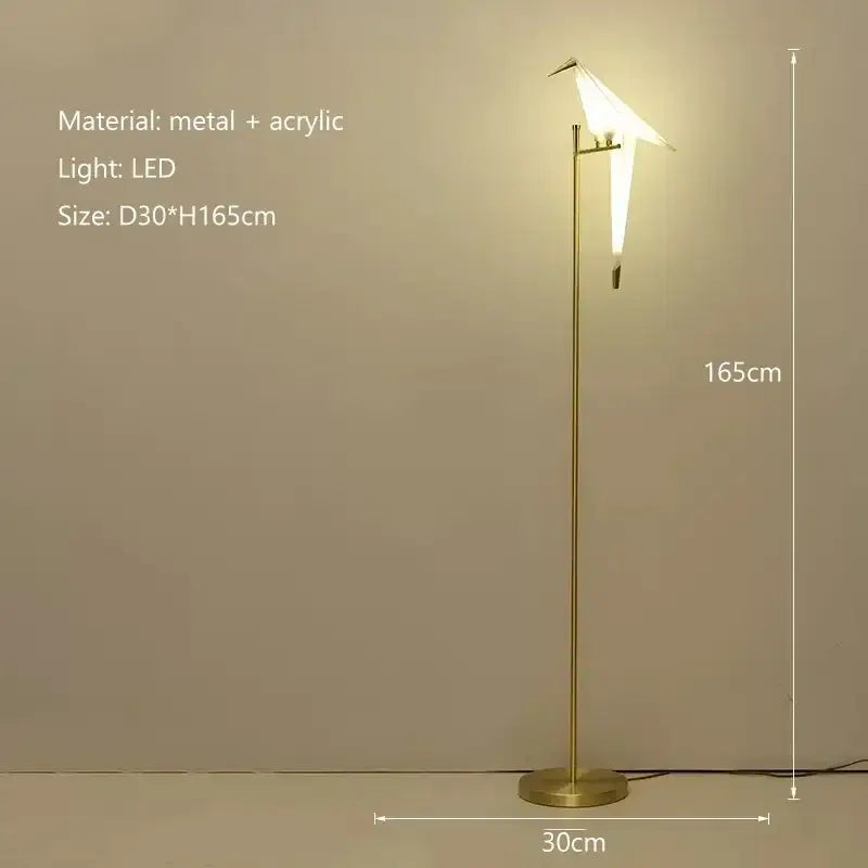 A modern gold-toned origami bird led floor lamp with a sleek metal stand for living room decorbites bird led lighting