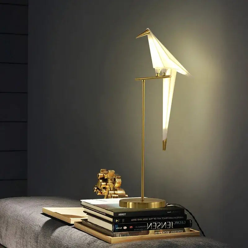 Gold-toned origami bird led floor lamp with sleek minimalist design providing warm ambient lighting for living room decorbites bird led