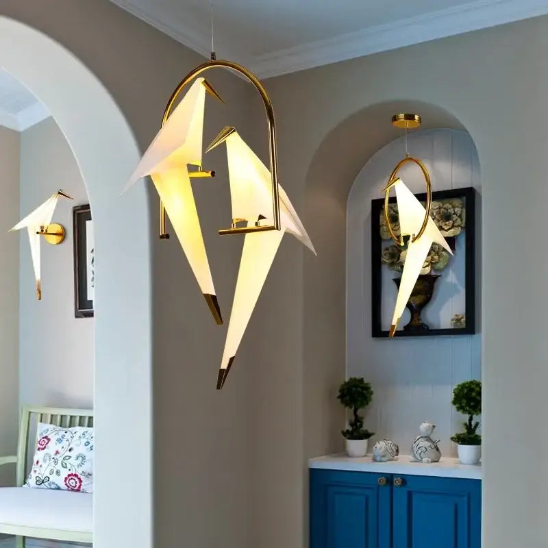 Gold-toned decorbites crane chandelier with translucent white paper wings and iron led frame for bedroom decor