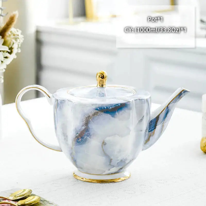Ornate 18th century scene bone china tea pot with white and blue marble pattern and gold-trimmed handle and spout decorbites bone china