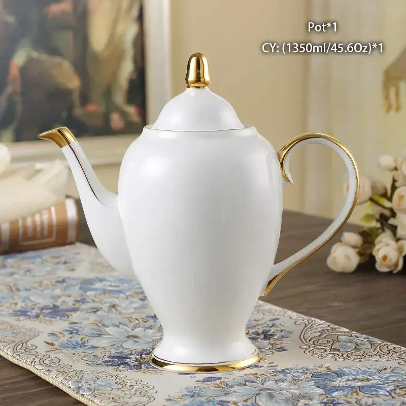 White porcelain bone china tea pot with gold-trimmed spout handle and base decorbites bone china ornate design