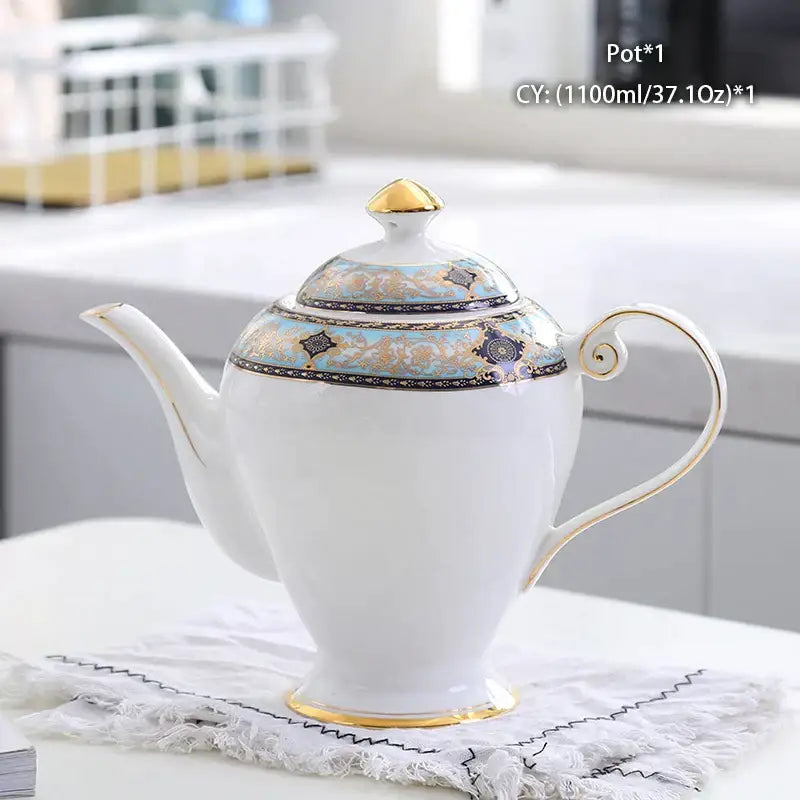 Ornate 18th century bone china tea pot with gold trim and blue black floral patterns by decorbites bone china