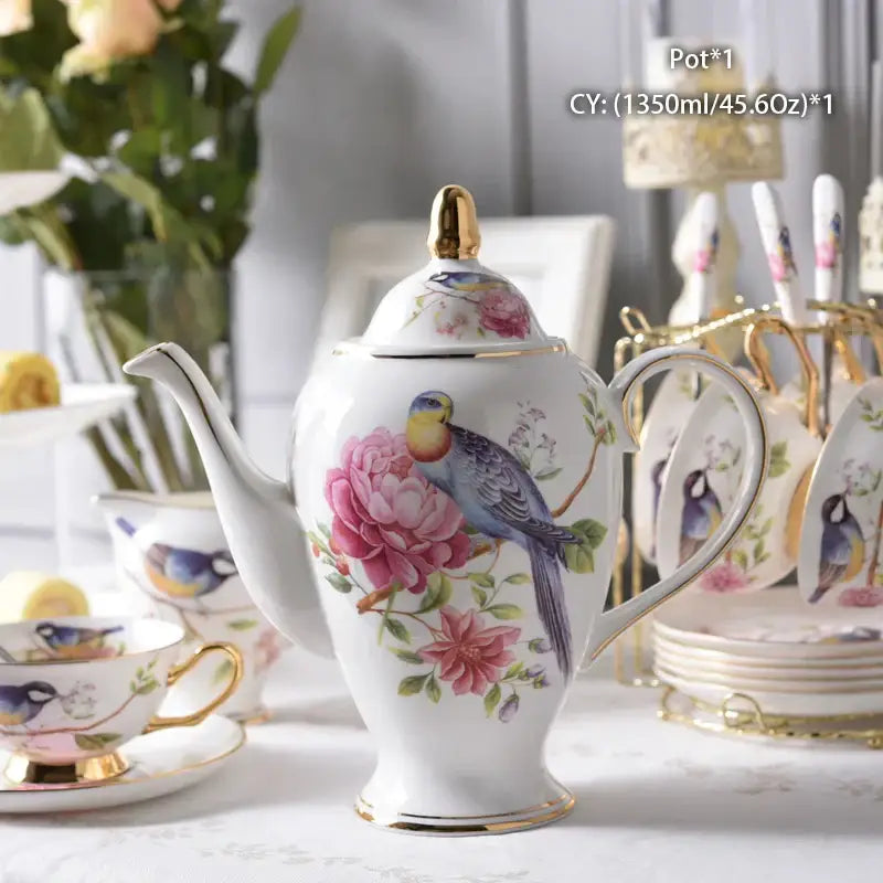 White porcelain tea pot with gold trim and hand-painted blue bird on pink roses decorbites bone china tea