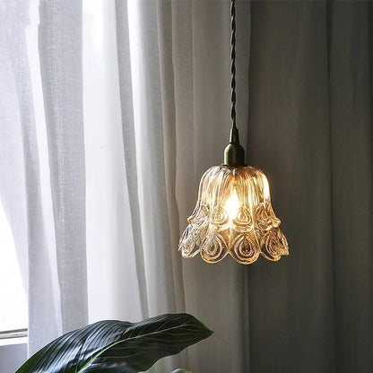 Ornate warm-toned amber copper led pendant light with petal design and antique brass finish for café and dining room