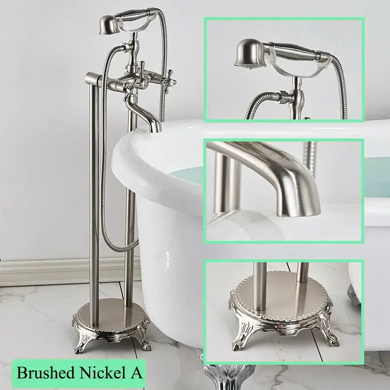 Brushed nickel freestanding bathtub filler with tall ornate stand and attached handheld showerhead for bathroom use