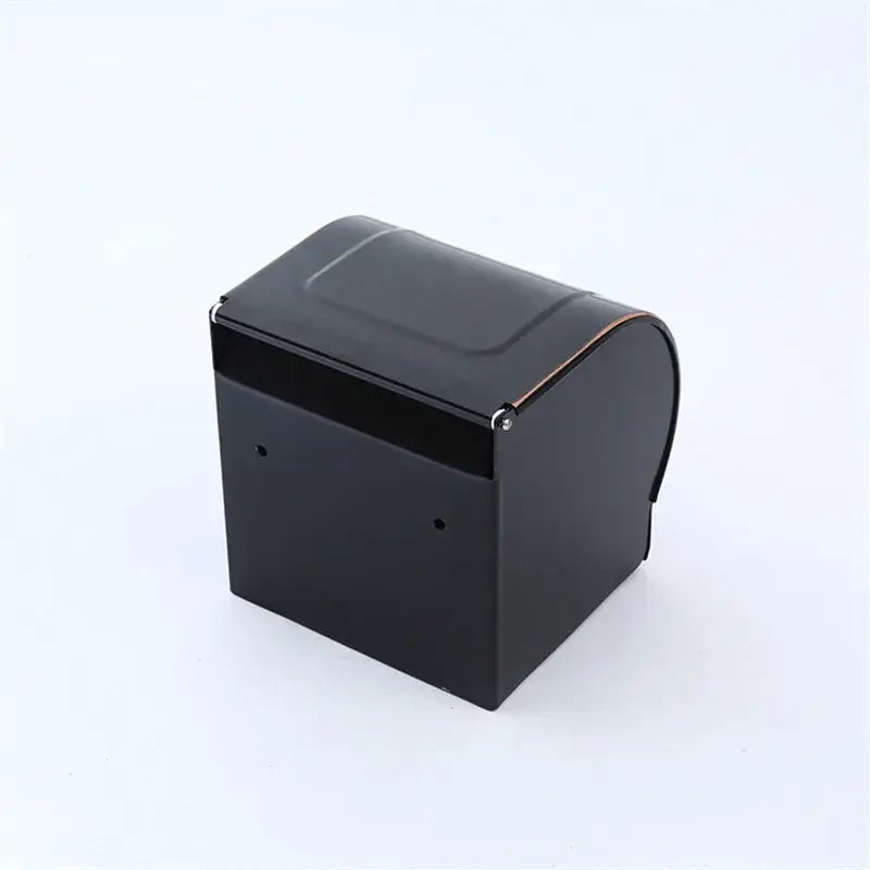 Black rectangular cash register with curved top and metallic hinge shown alongside decorbites black carved aluminum toilet paper holder