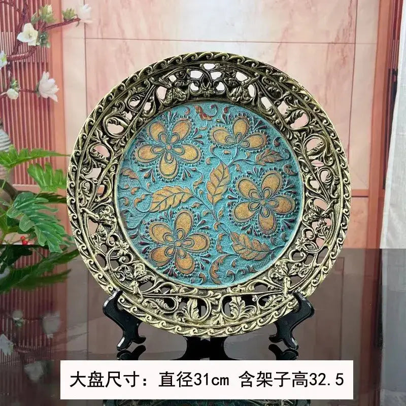 Antique-style decorative plate with gold-toned frame and turquoise center, complementing resin vase dried flowers decor