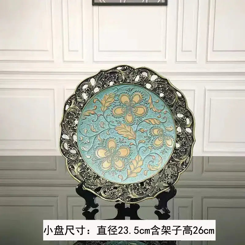 Ornate circular decorative plate with turquoise center and black metal filigree border for resin vase dried flowers decor