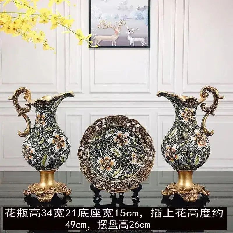 Pair of ornate black and gold resin vase dried flowers with floral patterns and golden handles for living room decor