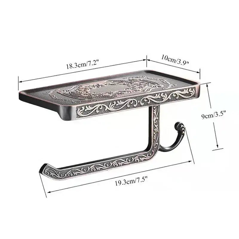 Ornate antique silver-toned metal toilet paper holder with intricate floral embossing and phone shelf bathroom storage